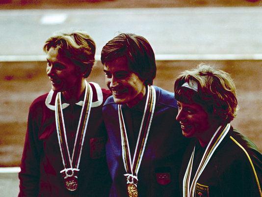 At the Tokyo Olympics in 1964, Karin Balzer (middle) celebrates her greatest athletic triumph: a gold medal for the 80-meter hurdles. 